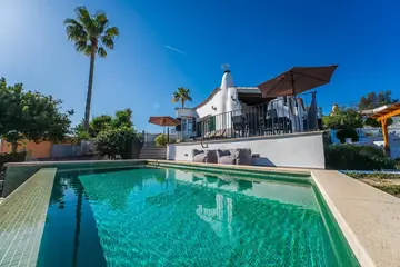 Private infinity pool, with the house behind