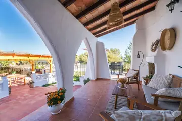 The arched porch, next to the garden