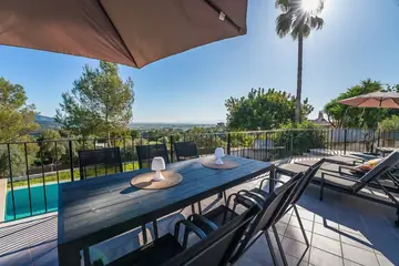 Sun-lounger terrace and outdoor dining table